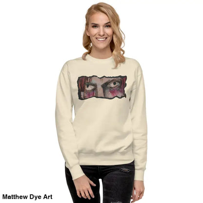 Woman in a cream sweatshirt with graphic print, showcasing urban elegance and classic silhouette