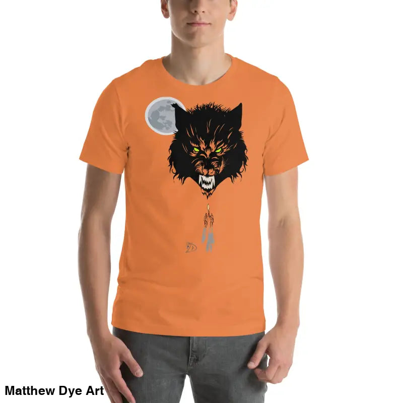 Orange t-shirt embodies a fierce wolf head design with glowing eyes and a full moon