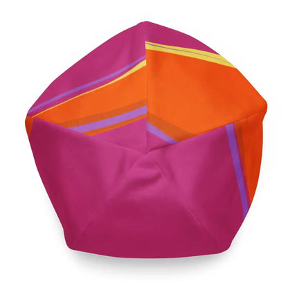 Bean bag chair featuring whimsical bat baby pattern in pink, orange, and purple blocks