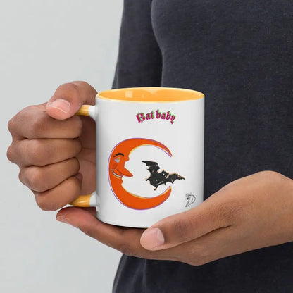 White coffee mug with black bat silhouette and vibrant orange crescent, First Baby text