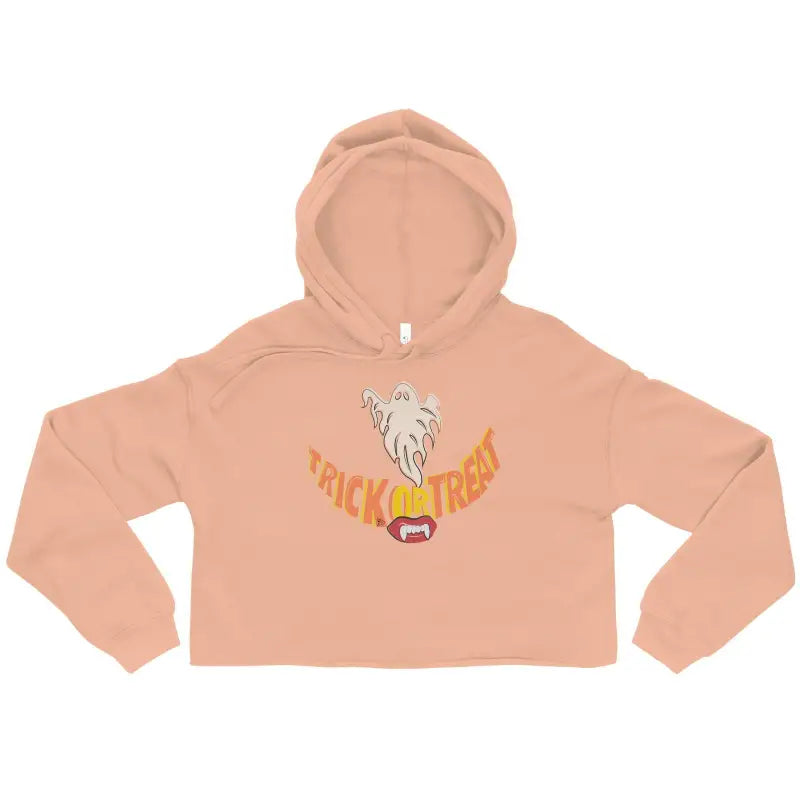 Peach-colored trick-or-treating cropped hoodie featuring a ghost design and vampire fangs