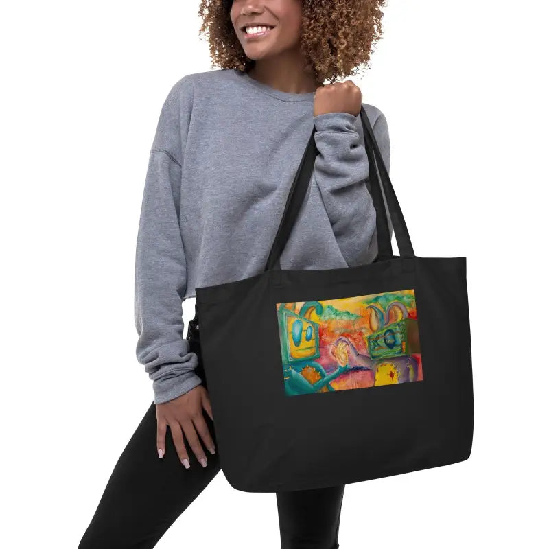 Black organic cotton tote showcasing colorful abstract artwork on the front