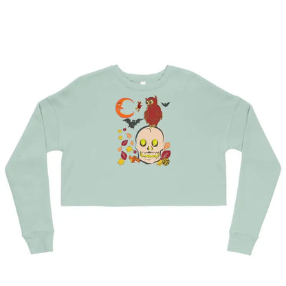 Mint green cropped sweatshirt with Halloween skull, cardinal, and leaves for haunted harvest fleece