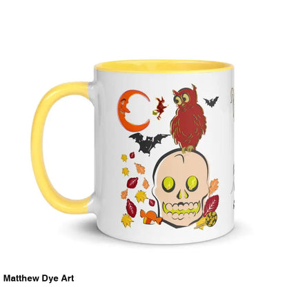 White ceramic mug with owl and skull Halloween artwork and yellow handle design