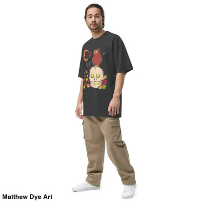 Man showcasing an oversized faded t-shirt in a Halloween theme, perfect for Haunted Harvest